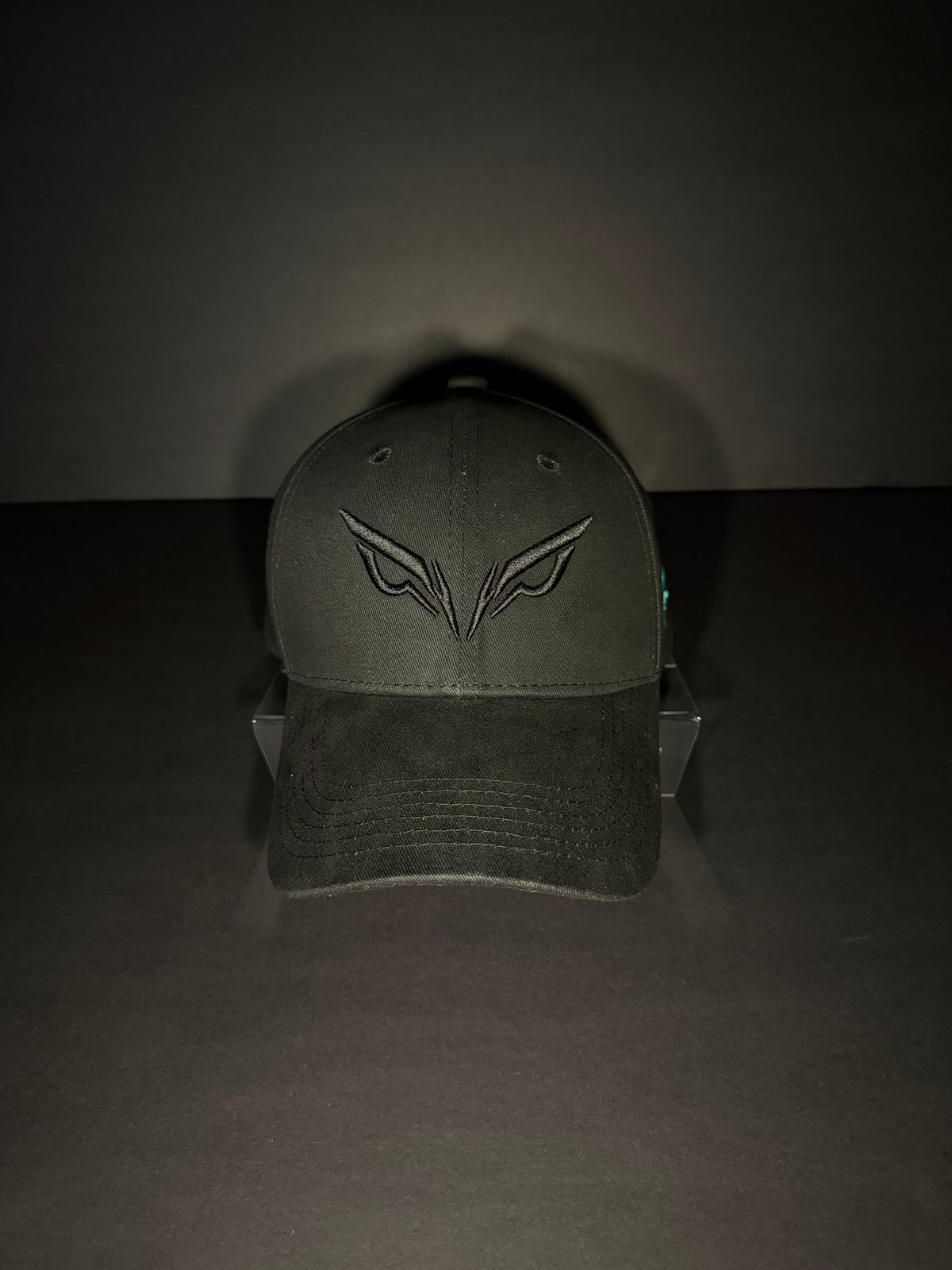 Black Hawkeye snapback cap with embroidered eyes logo
